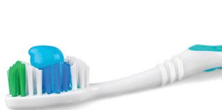 toothbrush with toothpaste on it